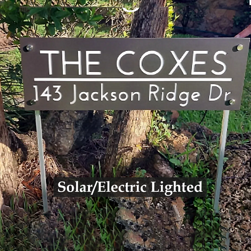 Radiant Solar-Powered Address Sign with Ground Stakes featuring a family name sign. A solar panel on top, LED lights, and ground stakes included.