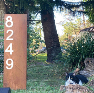Image of X Large 35" x 10" Lighted Modern Lawn Address Numbers Sign with Rusted Patina and Black Numbers, highlighting its stylish design, high-quality construction, and included solar spotlight for enhanced visibility at night.